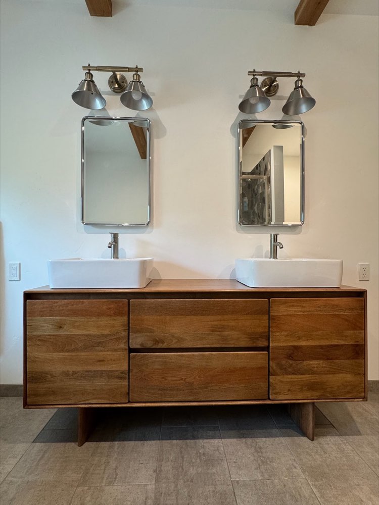 Double vanity with vessel sinks installed by Ivan's Plumbing