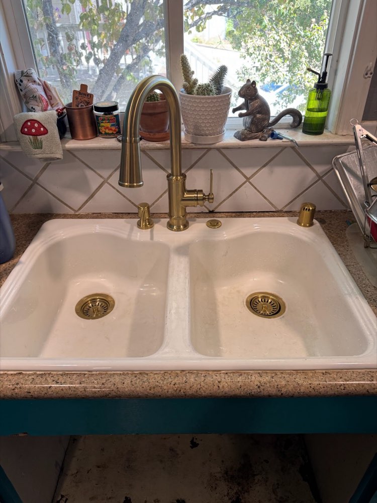 Brass kitchen faucet and double sink